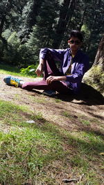 Portrait of a young woman sitting outdoors