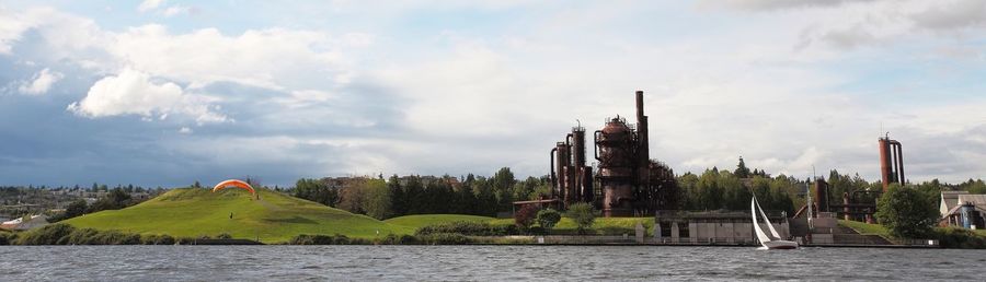 Built structures against cloudy sky