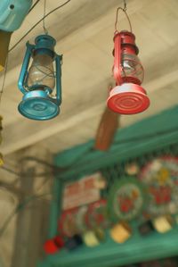 Low angle view of light bulb hanging on ceiling