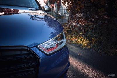 Close-up of car on street