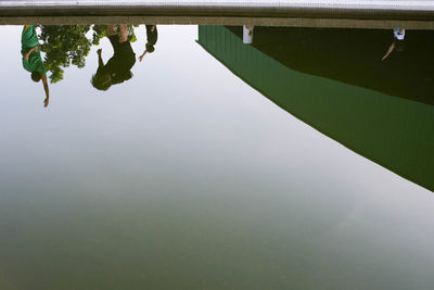 Reflection of trees in lake against sky