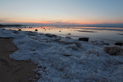 Scenic view of sea against sky during sunset