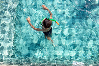 High angle view of boy in swimming pool