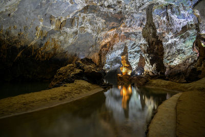 Reflection of cave in water