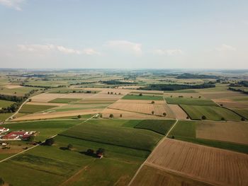 Aerial view of agricultural field against sky