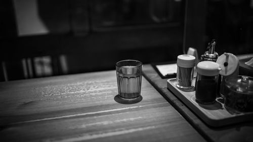 Close-up of wine glasses on table