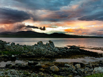 Scenic view of sea against dramatic sky