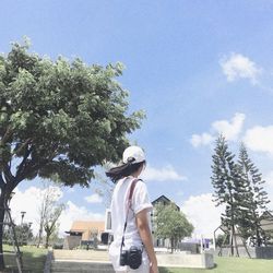 Rear view of woman sculpture against sky