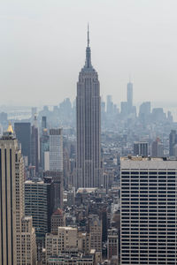 Modern buildings in city against sky