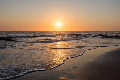 Scenic view of sea against sky during sunset