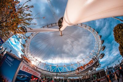 Low angle view of ferris wheel against sky