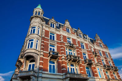 Low angle view of building against blue sky