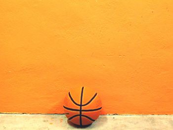 High angle view of orange table against wall