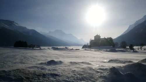 Scenic view of landscape against sky during winter