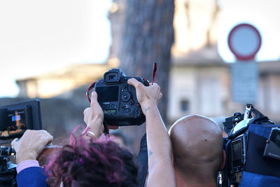 Midsection of man photographing