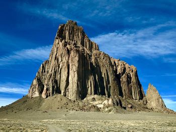 Low angle view of rock formations against sky