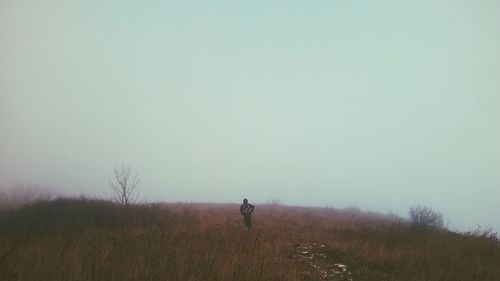 People walking on grassy field