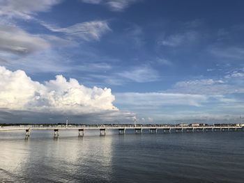 Pier over sea against sky