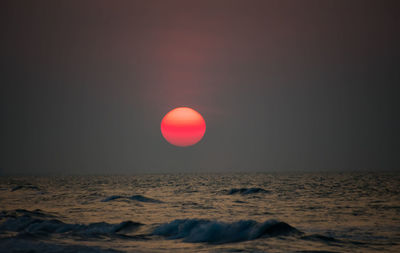 Scenic view of sea against clear sky during sunset