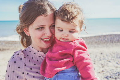 Portrait of a smiling young woman on beach