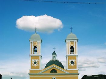 Low angle view of bell tower against sky