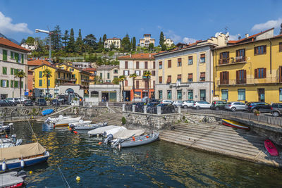 The beautiful port of menaggio with the colorful houses that are reflected on the water