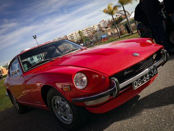 Red car against sky