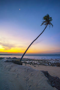 Scenic view of sea against sky at sunset