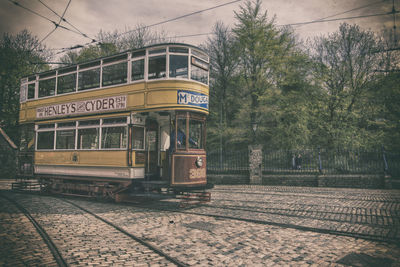 Train at railroad station against sky