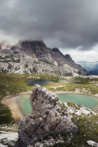 Scenic view of lake and mountains against sky