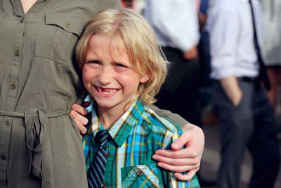 Portrait of smiling son with mother