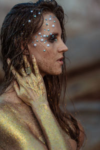 Close-up of young woman looking away