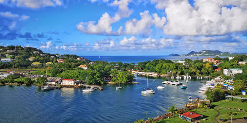 High angle view of sea and buildings against sky