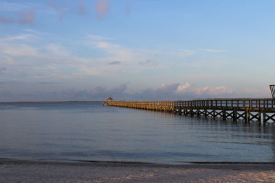 Pier over sea against sky