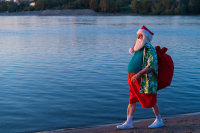 Full length of woman standing in lake