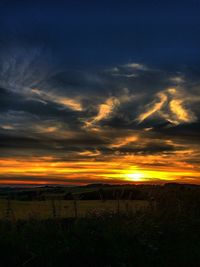 Scenic view of dramatic sky during sunset