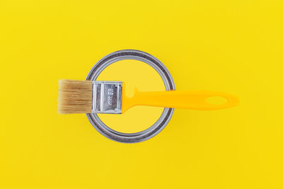 Close-up of padlock on yellow background