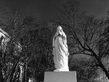 Low angle view of statue against sky