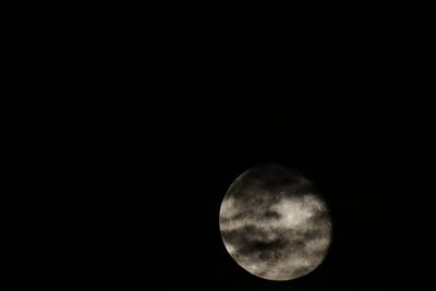 Low angle view of moon against clear sky at night