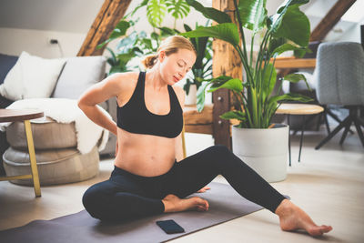 Pregnant woman exercising at home