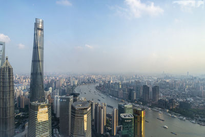 Aerial view of modern buildings in city against sky