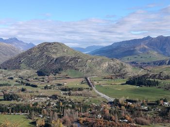 Scenic view of landscape and mountains against sky