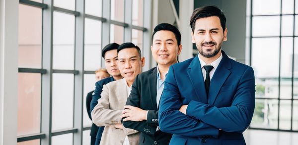 Business colleagues standing in office