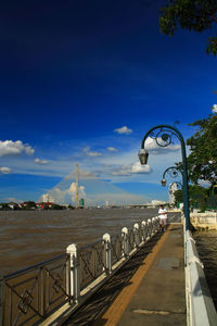 View of bridge over sea against cloudy sky