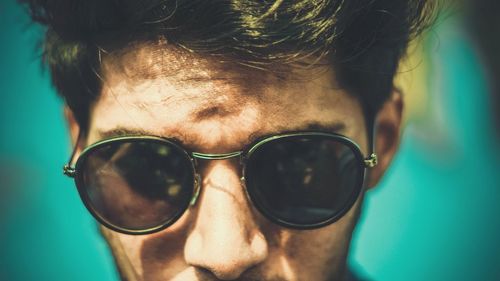 Close-up portrait of man wearing sunglasses