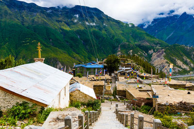 Panoramic view of historic building and mountains against sky