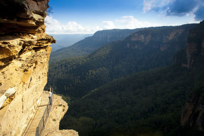 Woman walking on rock formation