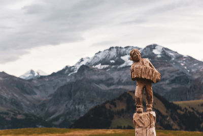 Stack of rocks against mountain range