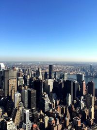 Cityscape against clear blue sky