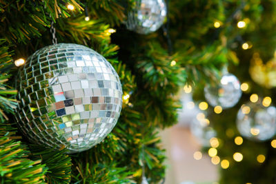 Close-up of illuminated christmas tree at night